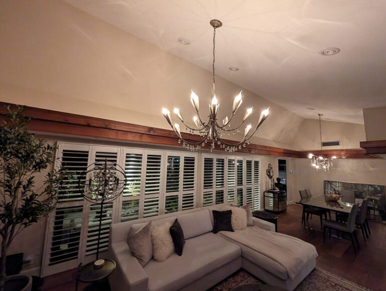 chandeliers on vaulted ceiling of home